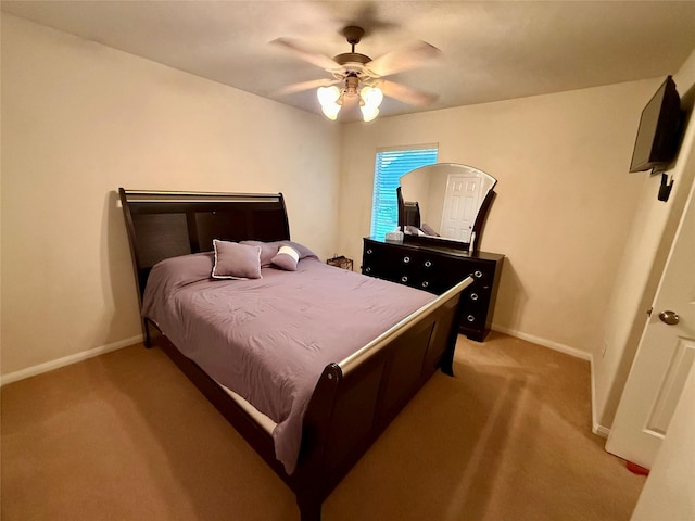 913 S Belle Dr, Angleton, TX 77515 - bedroom featuring light colored carpet and a ceiling fan
