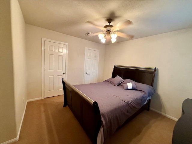 913 S Belle Dr, Angleton, TX 77515 - bedroom with light colored carpet and ceiling fan