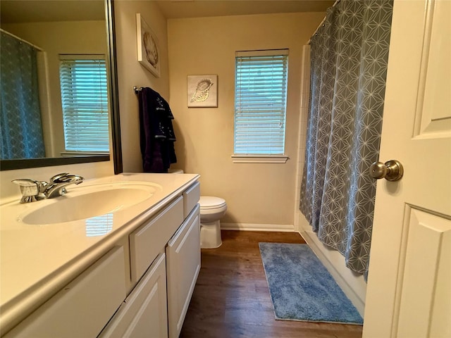 913 S Belle Dr, Angleton, TX 77515 - bathroom with vanity, wood finished floors, and shower / bath combination with curtain