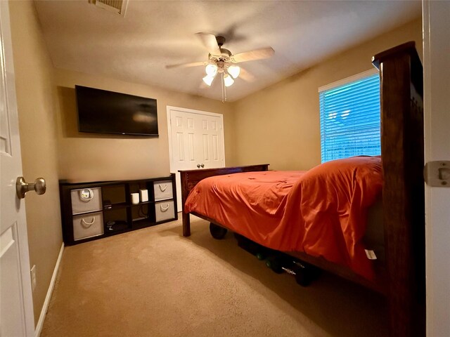 913 S Belle Dr, Angleton, TX 77515 - carpeted bedroom with baseboards and ceiling fan