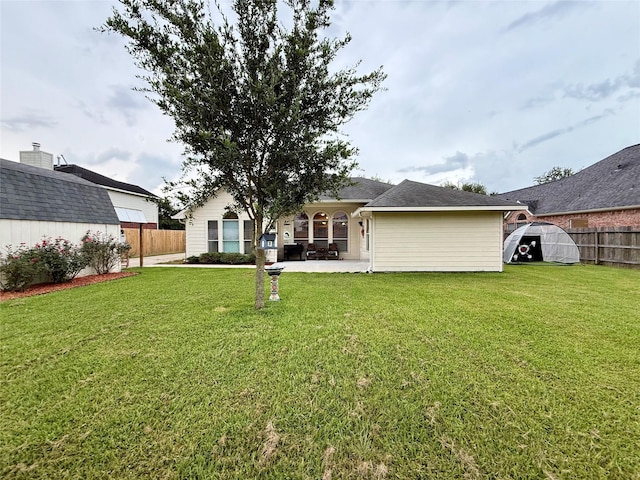 913 S Belle Dr, Angleton, TX 77515 - back of house featuring a patio area