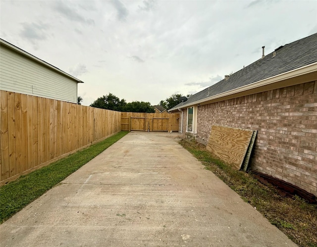 913 S Belle Dr, Angleton, TX 77515 - view of yard with driveway and a patio