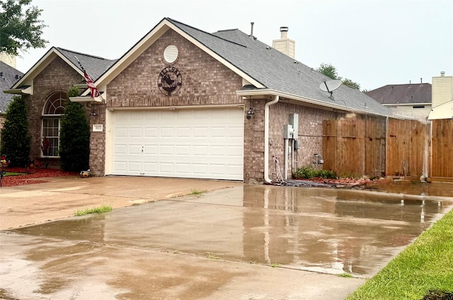 913 S Belle Dr, Angleton, TX 77515 - view of front of home with brick siding, concrete driveway, a garage, roof with shingles, and a chimney