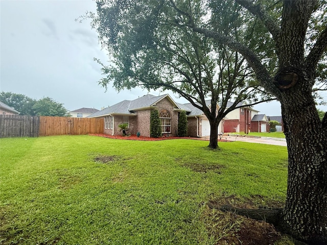 913 S Belle Dr, Angleton, TX 77515 - view of front of property featuring brick siding, an attached garage, and concrete driveway