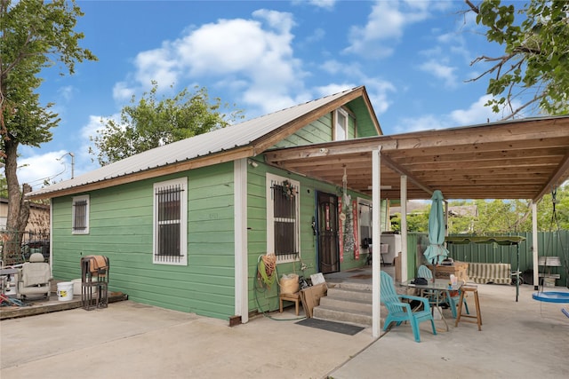 4103 Lumber Ln, Houston, TX 77016 - back of property with a patio area and a metal roof