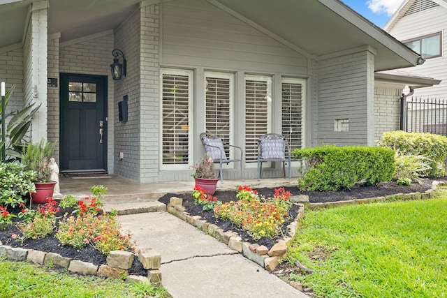 5743 Braesheather Dr, Houston, TX 77096 - doorway to property with brick siding and covered porch