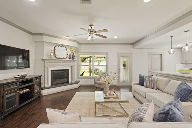5743 Braesheather Dr, Houston, TX 77096 - living room featuring recessed lighting, ornamental molding, dark wood-type flooring, ceiling fan, and a glass covered fireplace