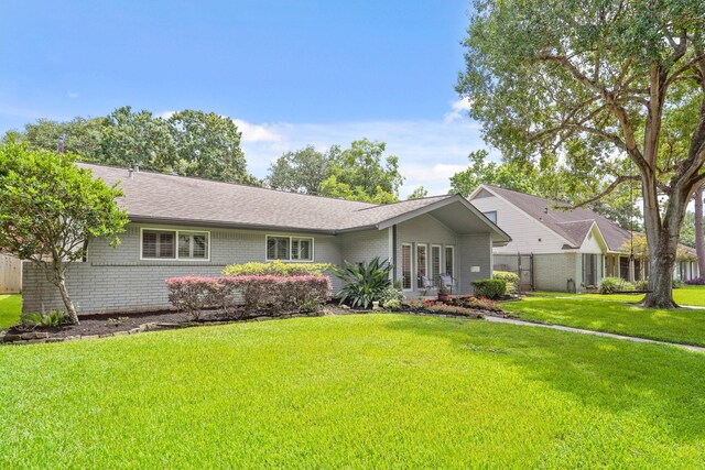 5743 Braesheather Dr, Houston, TX 77096 - ranch-style home featuring brick siding and french doors
