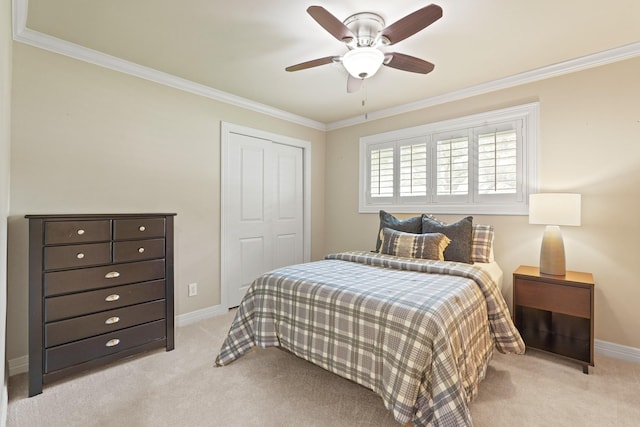 5743 Braesheather Dr, Houston, TX 77096 - bedroom with light colored carpet, crown molding, a closet, and a ceiling fan