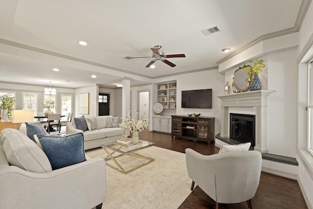 5743 Braesheather Dr, Houston, TX 77096 - living area featuring ceiling fan, dark wood-style floors, ornamental molding, recessed lighting, and built in features