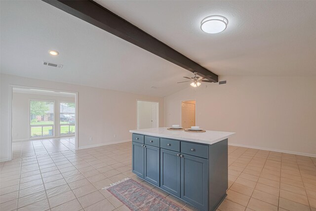 3810 Marlin Ln, La Porte, TX 77571 - kitchen with ceiling fan, light tile patterned flooring, open floor plan, gray cabinetry, and light countertops