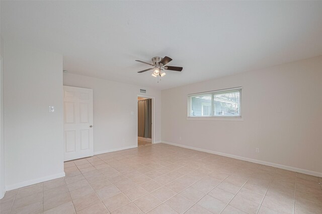 3810 Marlin Ln, La Porte, TX 77571 - spare room featuring a ceiling fan and light tile patterned flooring
