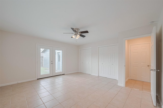3810 Marlin Ln, La Porte, TX 77571 - unfurnished bedroom featuring light tile patterned floors, multiple closets, french doors, access to outside, and a ceiling fan