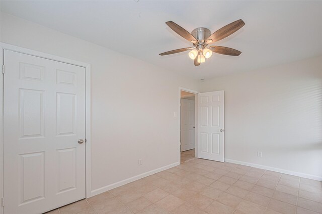 3810 Marlin Ln, La Porte, TX 77571 - spare room featuring a ceiling fan and baseboards