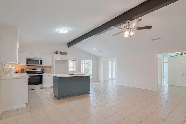 3810 Marlin Ln, La Porte, TX 77571 - kitchen featuring stainless steel appliances, open floor plan, light countertops, and light tile patterned flooring
