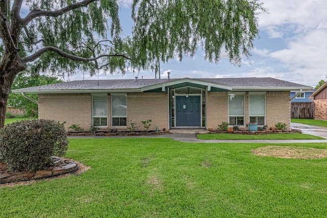 3810 Marlin Ln, La Porte, TX 77571 - mid-century modern home with brick siding and a front lawn
