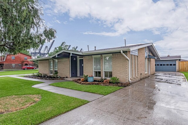 3810 Marlin Ln, La Porte, TX 77571 - mid-century home featuring brick siding, a front yard, an outbuilding, and concrete driveway