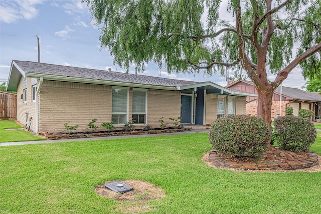 3810 Marlin Ln, La Porte, TX 77571 - view of front facade featuring brick siding and a front yard