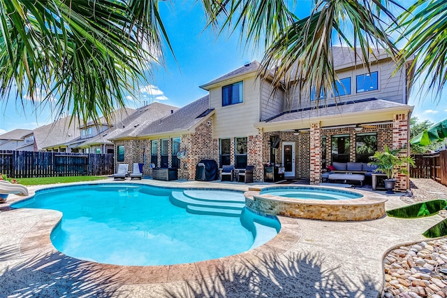 20910 Cordell Landing Dr, Richmond, TX 77407 - view of swimming pool with an outdoor hangout area, a ceiling fan, a patio, a pool with connected hot tub, and a fenced backyard