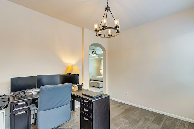 20910 Cordell Landing Dr, Richmond, TX 77407 - office area featuring arched walkways, a chandelier, light wood-type flooring, and a ceiling fan