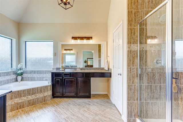 20910 Cordell Landing Dr, Richmond, TX 77407 - bathroom with vanity, a bath, a stall shower, and vaulted ceiling