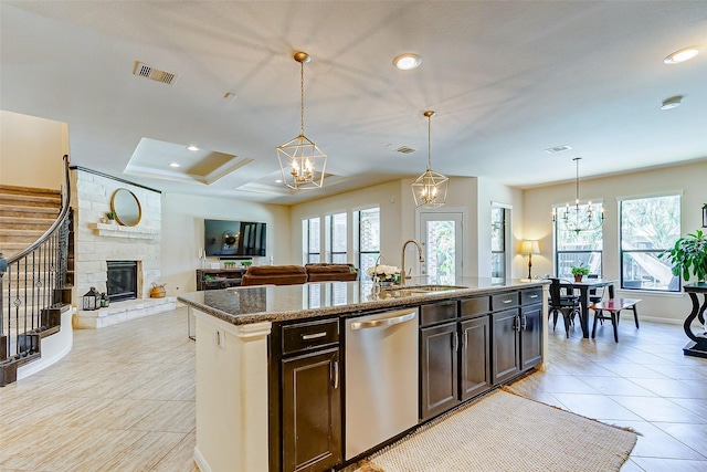 20910 Cordell Landing Dr, Richmond, TX 77407 - kitchen featuring dishwasher, a chandelier, healthy amount of natural light, a kitchen island with sink, and recessed lighting