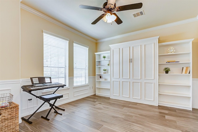 20910 Cordell Landing Dr, Richmond, TX 77407 - office space featuring a ceiling fan, ornamental molding, light wood-type flooring, and wainscoting
