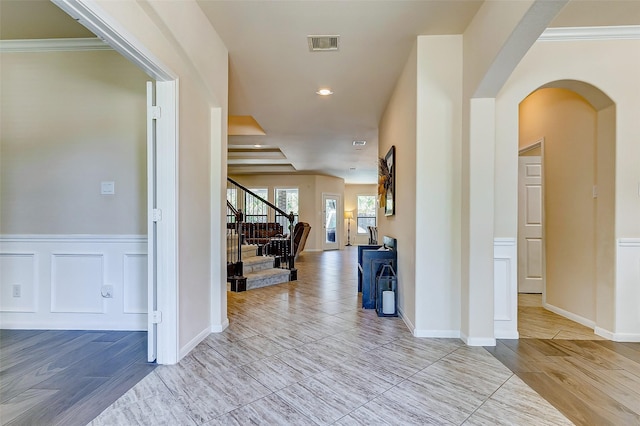 20910 Cordell Landing Dr, Richmond, TX 77407 - hallway featuring stairs, arched walkways, crown molding, and recessed lighting