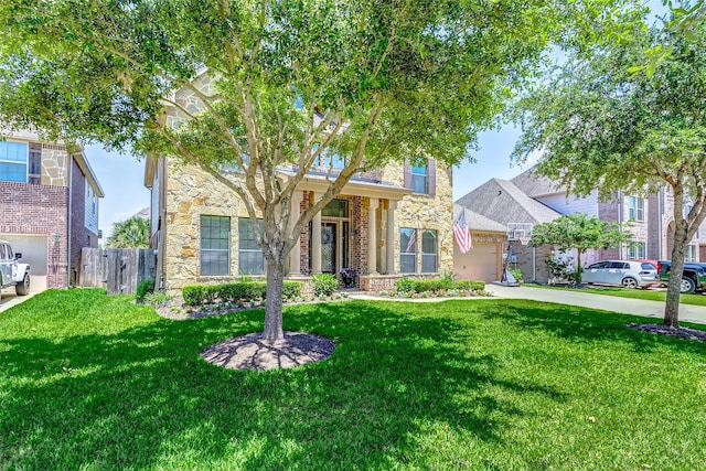 20910 Cordell Landing Dr, Richmond, TX 77407 - view of front of house featuring stone siding, driveway, and a garage