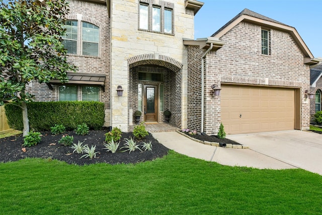 5409 Aroma Knoll Ln, Rosharon, TX 77583 - view of front of property featuring an attached garage, concrete driveway, brick siding, and a front yard