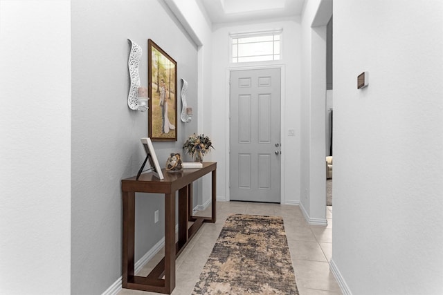 222 Speckled Woods Pl, Conroe, TX 77318 - foyer with light tile patterned floors and baseboards