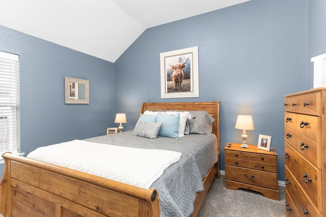 222 Speckled Woods Pl, Conroe, TX 77318 - carpeted bedroom with vaulted ceiling and baseboards