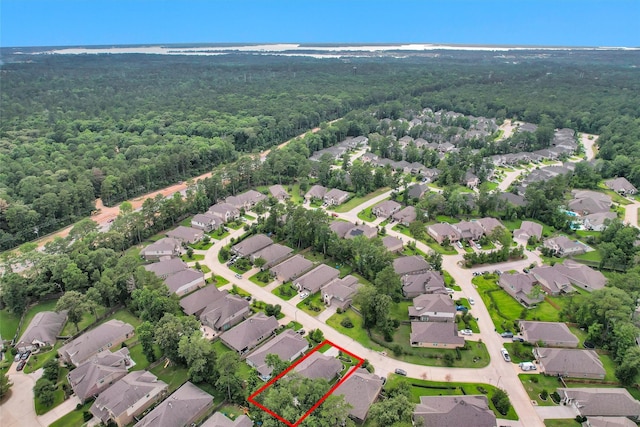 222 Speckled Woods Pl, Conroe, TX 77318 - aerial view of residential area featuring a heavily wooded area and property boundaries highlighted