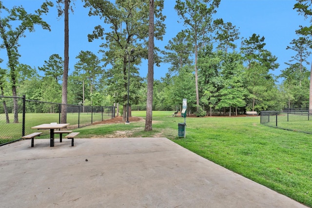 222 Speckled Woods Pl, Conroe, TX 77318 - view of patio / terrace featuring view of scattered trees