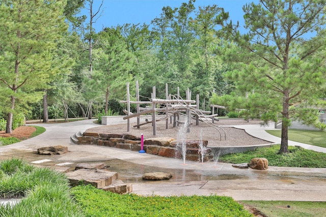 222 Speckled Woods Pl, Conroe, TX 77318 - view of jungle gym with view of wooded area
