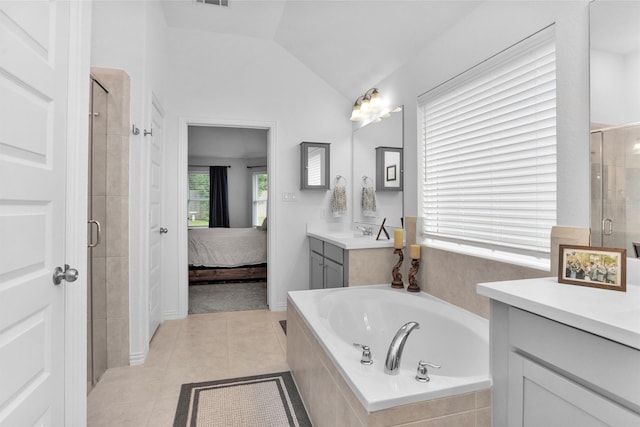 222 Speckled Woods Pl, Conroe, TX 77318 - full bath with a stall shower, vanity, a garden tub, vaulted ceiling, and ensuite bathroom