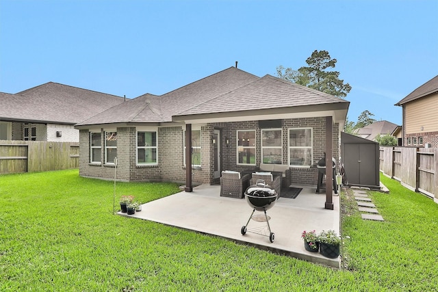 222 Speckled Woods Pl, Conroe, TX 77318 - rear view of house with brick siding, a fenced backyard, a storage shed, and an outdoor hangout area
