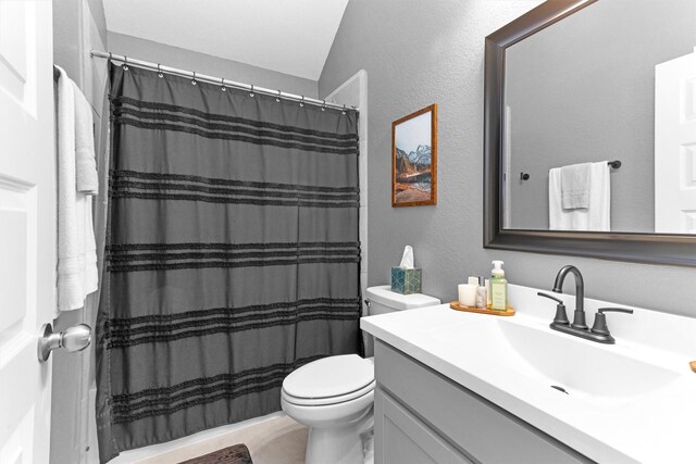 222 Speckled Woods Pl, Conroe, TX 77318 - bathroom with vanity, curtained shower, and a textured wall