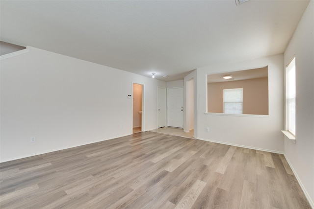 2614 Skyview Shadows Ct, Houston, TX 77047 - spare room with light wood-style flooring and baseboards