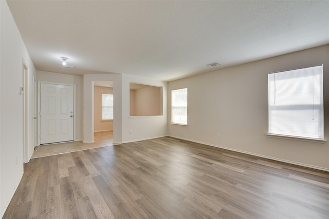 2614 Skyview Shadows Ct, Houston, TX 77047 - spare room featuring healthy amount of natural light and light wood-type flooring
