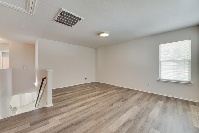2614 Skyview Shadows Ct, Houston, TX 77047 - unfurnished room with attic access and light wood-style flooring