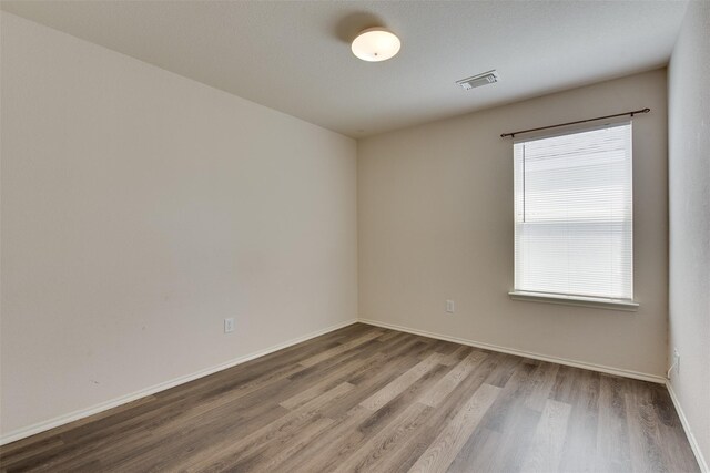 2614 Skyview Shadows Ct, Houston, TX 77047 - empty room with wood finished floors and baseboards