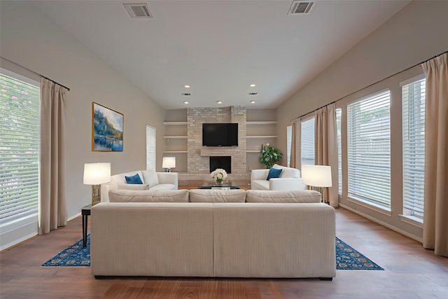 10815 Shawnbrook Dr, Houston, TX 77071 - living room with built in features, a fireplace, recessed lighting, and wood finished floors