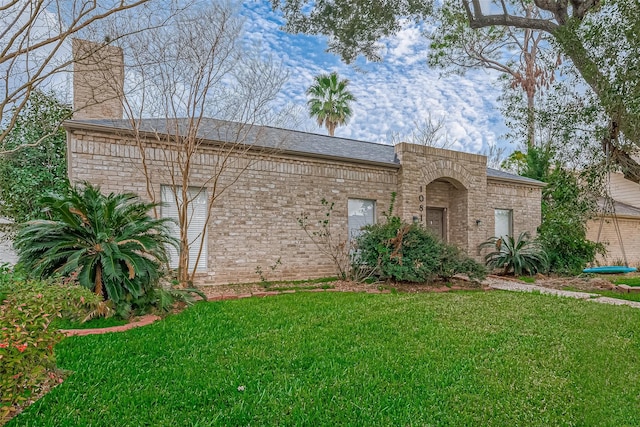 10815 Shawnbrook Dr, Houston, TX 77071 - view of front of home with a front lawn, a chimney, and brick siding