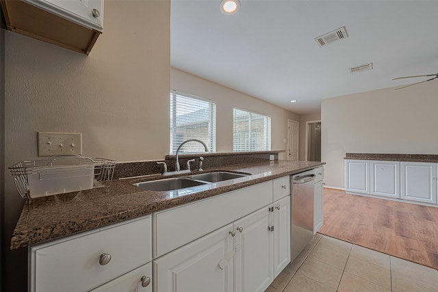 10815 Shawnbrook Dr, Houston, TX 77071 - kitchen featuring dishwasher, light tile patterned flooring, dark stone counters, white cabinets, and recessed lighting