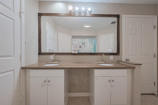 10815 Shawnbrook Dr, Houston, TX 77071 - full bath with tile patterned floors and double vanity