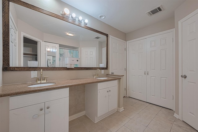 10815 Shawnbrook Dr, Houston, TX 77071 - full bathroom with double vanity, tile patterned flooring, a closet, and a shower