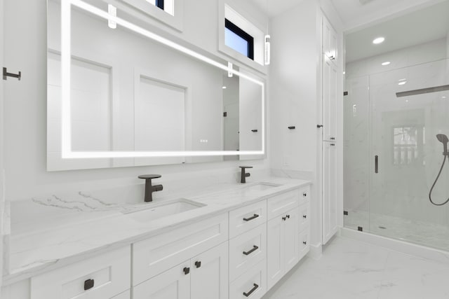 5115 Maple St, Houston, TX 77401 - bathroom featuring a marble finish shower, marble look tiles, double vanity, and recessed lighting