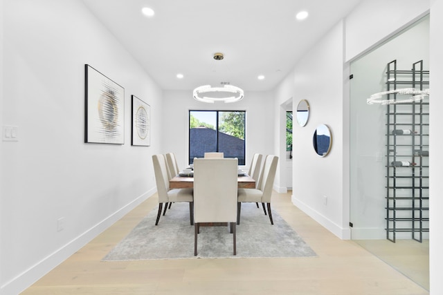 5115 Maple St, Houston, TX 77401 - dining room featuring recessed lighting, light wood-style floors, and a chandelier
