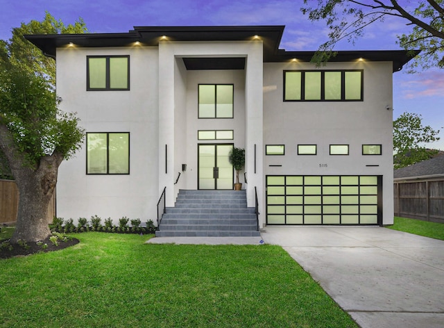 5115 Maple St, Houston, TX 77401 - modern home featuring stucco siding, concrete driveway, and an attached garage